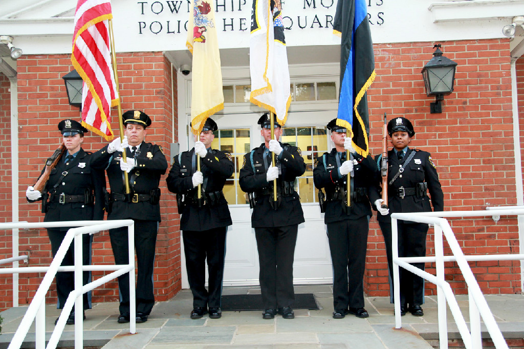 Honor Guard poses in front of headquarters. 